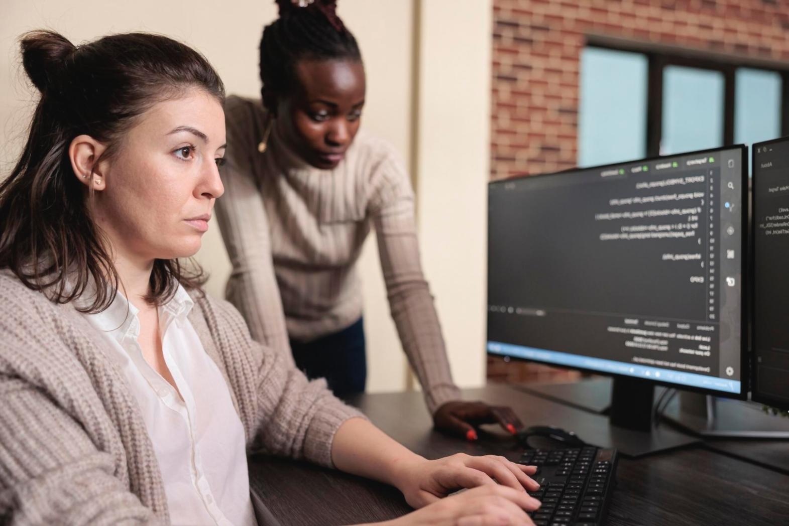 Student working on adaptive web design project in modern workspace